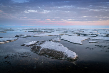 ice drift on Lake Baikal at the source of the Angara River in spring
