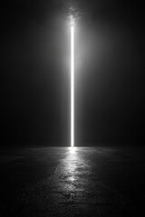 Dramatic vertical light beam in dark, empty room.