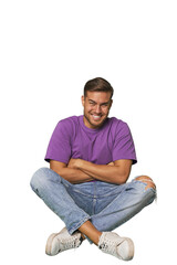 Casual man sitting on floor laughing and having fun.