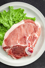 Pork on bones raw meat fresh tasty food dish delicious gourmet food background on the table rustic food top view copy space