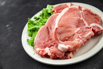 Pork on bones raw meat fresh tasty food dish delicious gourmet food background on the table rustic food top view copy space