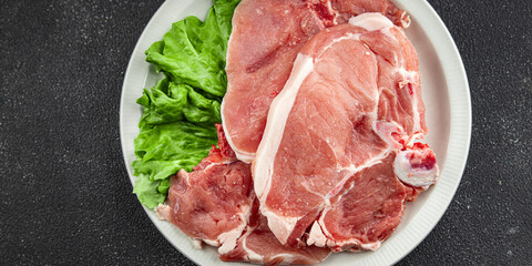 Pork on bones raw meat fresh tasty food dish delicious gourmet food background on the table rustic food top view copy space