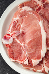 Pork on bones raw meat fresh tasty food dish delicious gourmet food background on the table rustic food top view copy space