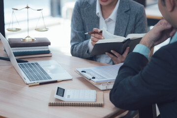 Legal Consultation: A legal professional, dressed in a smart suit, carefully reviews a case file...