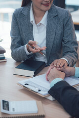 Business Professional Counseling: A compassionate business professional gestures with empathy towards a client, offering comfort and reassurance, emphasizing the human connection in business.