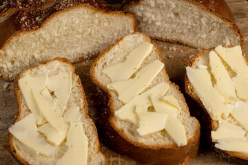a soft loaf of wheat flour with butter on the table