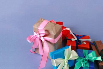Pile of gift boxes on a blue background.