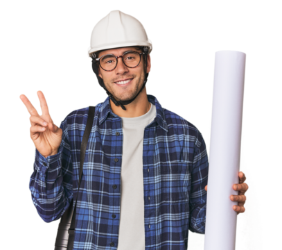 Young Hispanic architect with plans joyful and carefree showing a peace symbol with fingers.