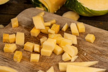 diced soft ripe pumpkin of orange color, fresh pumpkin for cooking