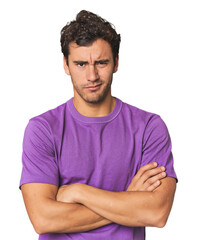 Obraz premium Young Hispanic man in studio unhappy looking in camera with sarcastic expression.