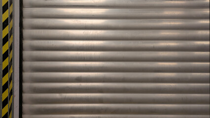 Close up of an used roller shutter, storage door