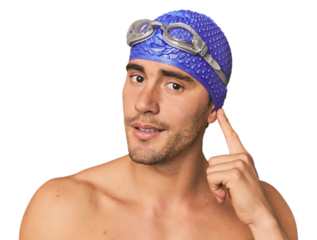 Close-up of Hispanic male swimmer with goggles, winner's attitude