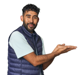 Young Hispanic man isolated looking sideways with doubtful and skeptical expression.