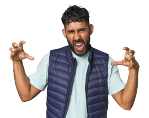Young Hispanic man isolated screaming with rage.