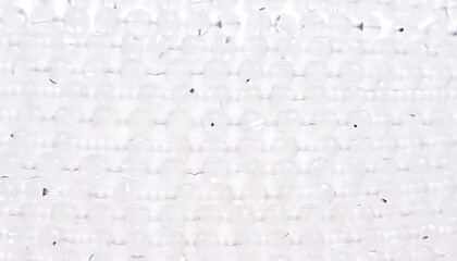 A Close Up View Of Many White Round Beads