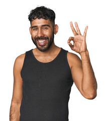 Young Hispanic man isolated cheerful and confident showing ok gesture.