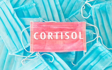 Blue and pink mask with the word Cortisol written on it