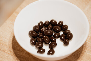 beans in chocolate  in a white  bowl