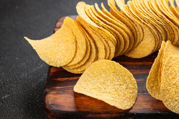 potato chips fast food fresh tasty food dish gourmet food background on the table rustic food top...