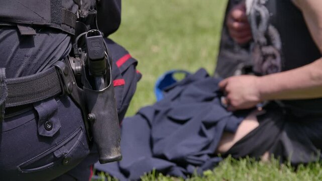Police officer helping a fentanyl addict in distress