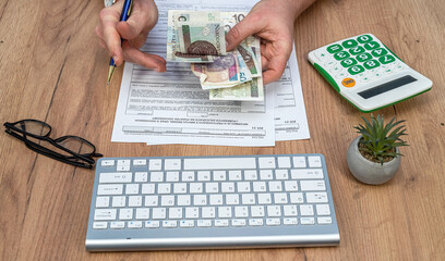 man count polish zloty money when fill tax form PIT-37 for individual tax return. Taxation concept
