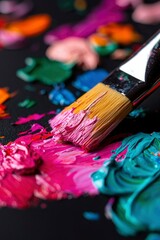 Fototapeta premium Paintbrush Applying Vibrant Colors To Canvas