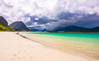 Rambergstranda Beach, Lofoten islands is an archipelago in the county of Nordland, Norway. Is known for a distinctive scenery with dramatic mountains and peaks.