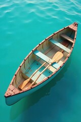 Obraz premium Tranquil Serenity A weathered wooden rowboat rests gently on the surface of a vibrant turquoise body of water, its oars neatly placed within, ready for a peaceful voyage.