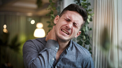 Naklejka premium Man Experiencing Neck and Throat Pain, Holding His Neck in Discomfort, Showing Tension and Strain, Unwell Expression, Physical Health Strain, Symptoms of Sore Throat or Muscle Tightness in the Neck