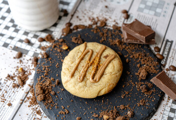 Cup of Coffee and Chocolate on Newspaper Games Page