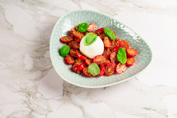 Farmer Italian soft cheese mozzarella served with fresh basil and red cherry tomatoes