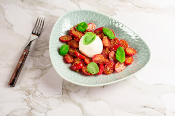 Farmer Italian soft cheese mozzarella served with fresh basil and red cherry tomatoes
