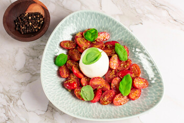 Farmer Italian soft cheese mozzarella served with fresh basil and red cherry tomatoes