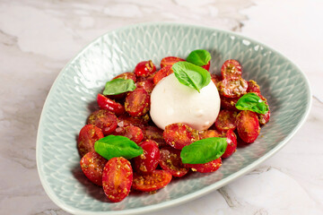 Farmer Italian soft cheese mozzarella served with fresh basil and red cherry tomatoes