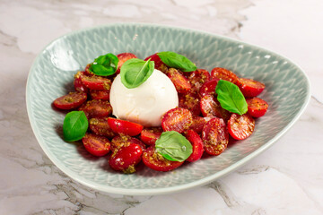 Farmer Italian soft cheese mozzarella served with fresh basil and red cherry tomatoes