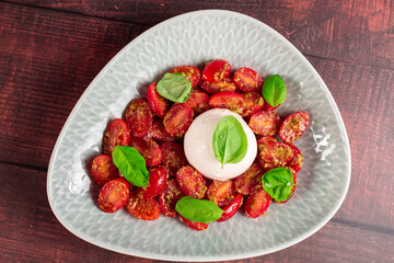 Farmer Italian soft cheese mozzarella served with fresh basil and red cherry tomatoes