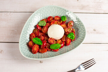 Farmer Italian soft cheese mozzarella served with fresh basil and red cherry tomatoes
