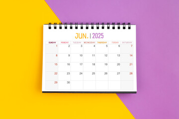 June 2025 Monthly desk calendar for 2025 year on yellow and purple.