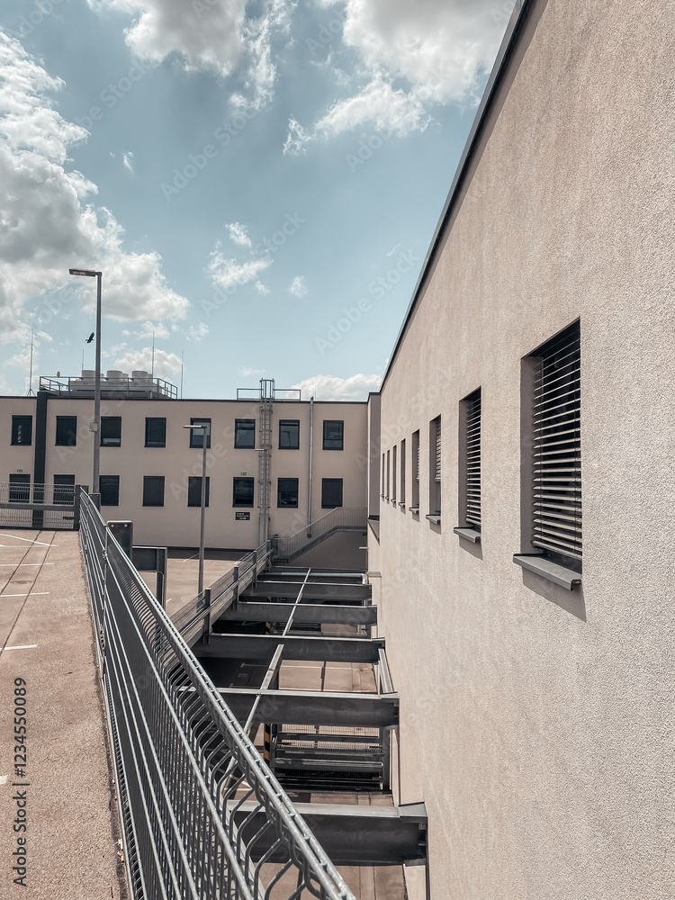 Poster building with a lot of windows and a fence