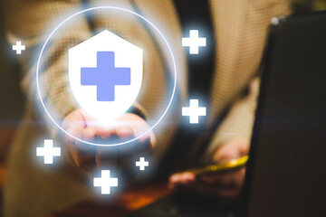 A sales executive holding of health care icons, medical technology background, health insurance...