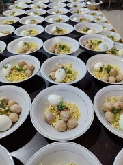 bowls of bakso or meatballs on table