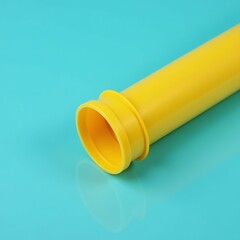 Yellow plastic sewage pipe on blue background, symbolizing plumbing installation and flow.