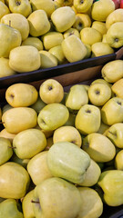 Apples for sale in a supermarket. Ripe juicy apples close-up with selective focus. Fruits. A pile of apples for sale in a store. A variety of fresh apples on a supermarket counter