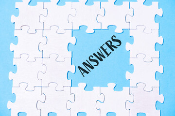 Puzzle with the word answers written in black on it