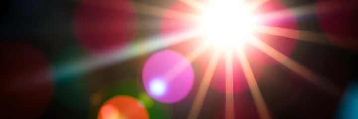 Dynamic light burst background with colorful bokeh effects for creative visuals and design
