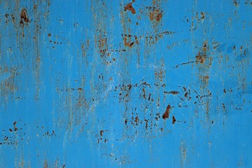Background, texture metal surface covered with blue paint with rust showing through