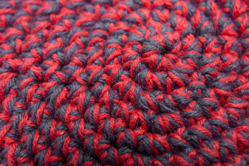 Knitted with a crochet hook, spiral shaped pattern texture, abstract woven backdrop