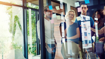 Planning, ideas and business people at glass with collaboration, sticky note and brainstorming in...