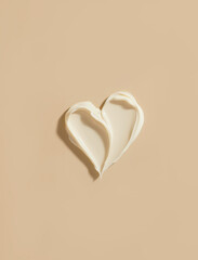 Top View of Heart-Shaped Cream Swatch Smear on Sunlit Beige Background