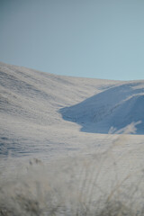 Snow covered valley hillside
